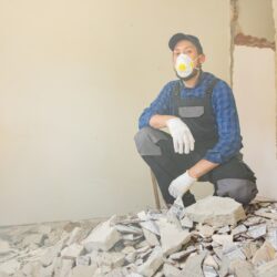 A,Men,Cleans,Up,After,Renovation,,Construction,Of,A,House.