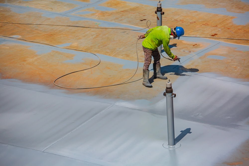 A,Male,Worker,Holding,An,Industrial,Spray,Gun,Used,For