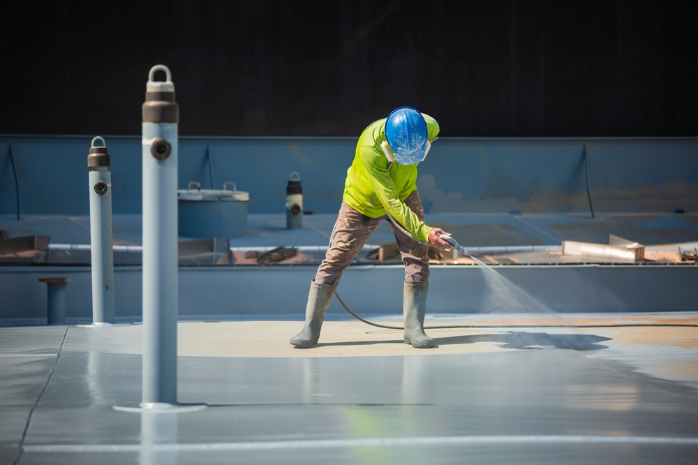A,Male,Worker,Holding,An,Industrial,Spray,Gun,Used,For