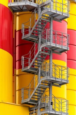 An,External,Metal,Staircase,On,The,Silos,In,A,Petrochemical