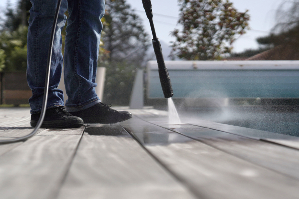 Man,Using,High,Pressure,Washer,Cleaning,Deck