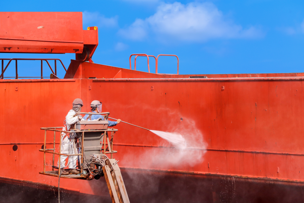 Worker,Washing,In,Dry,Dock,With,Water,Jet,Cleans,The