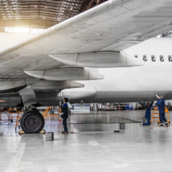 Several,People,Wash,The,Aircraft,In,The,Hangar,For,Maintenance,