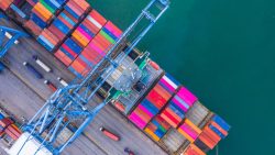 Container,Ship,Loading,And,Unloading,In,Deep,Sea,Port,,Aerial